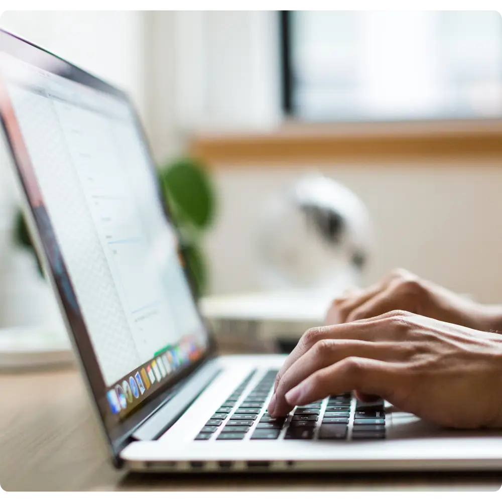 Typing on laptop